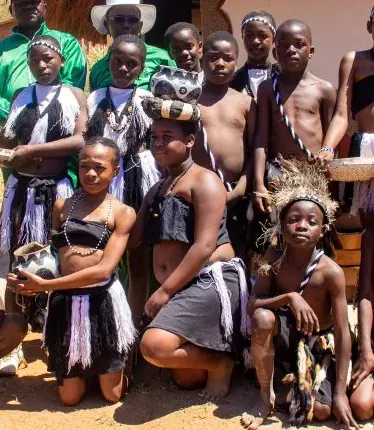 Young dancers in beaded headbands and costume