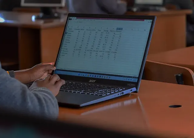 A learner at a laptop